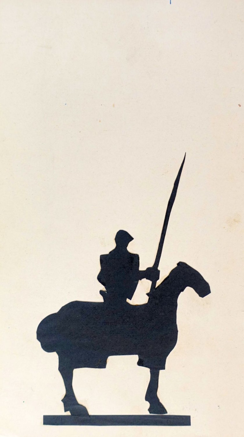 Scherenschnitt-Arbeit des jungen René Gilsi, Silhouette eines Ritters auf einem Pferd mit einer Lanze.